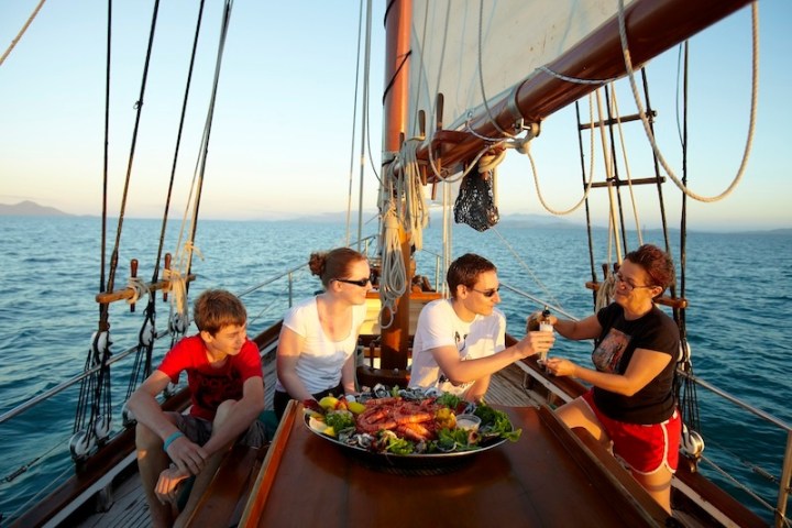 a group of people in a boat on a body of water