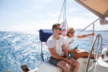 a man sitting in a boat on a body of water