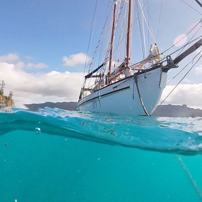 a close up of a boat next to a body of water