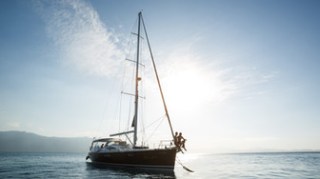 a small boat in a large body of water