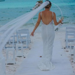 a person standing next to a body of water