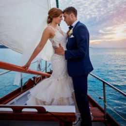 a person standing next to a body of water