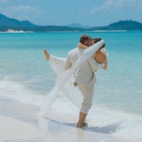 a person standing next to a body of water