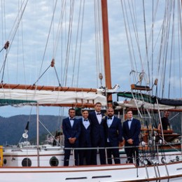 a boat is docked next to a body of water