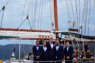 a boat is docked next to a body of water