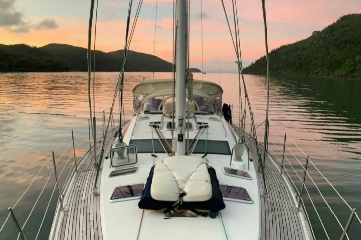 a boat is docked next to a body of water