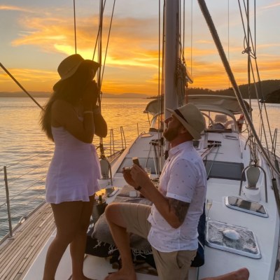 a couple of people that are standing in a boat on the water