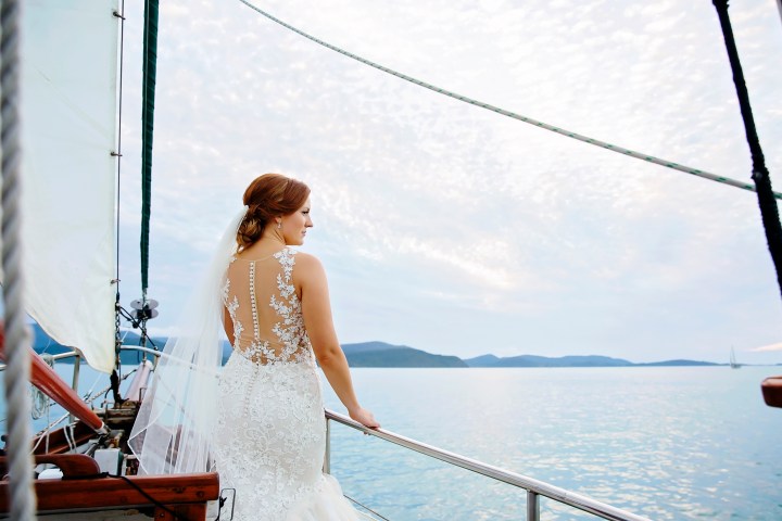 a person standing next to a body of water