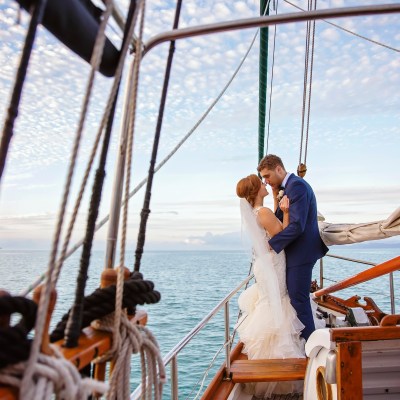 a group of people on a swing in a body of water